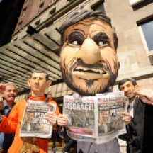 Group of protestors wearing masks, protesting against Mahmoud Ahmadinejad staying at Warwick Hotel, NYC