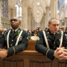 Officers praying during St. Patrick's Day mass in St. Patrick's Cathedral.