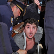 Protester being arrested at Occupy Wall Street demonstration at corner of William St. and Pine St., NYC