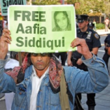 Protester holding sign at Aafia Siddiqui sentencing at US District Court, 500 Pearl, NYC.