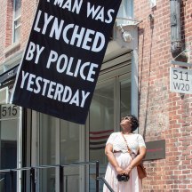 Flag outside Jack Shaman Gallery, work of artist Dread Scott, which says: A Man Was Lynched By Police Yesterday, West 20th St. NYC.